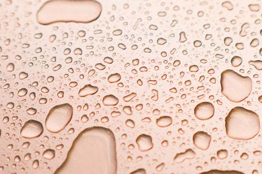 a close up of water droplets on a surface