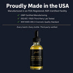 A bottle of Glenari Botanical Hair Serum with a black dropper cap and black label, filled with golden-yellow liquid, centered on a dark navy background with marketing text above.