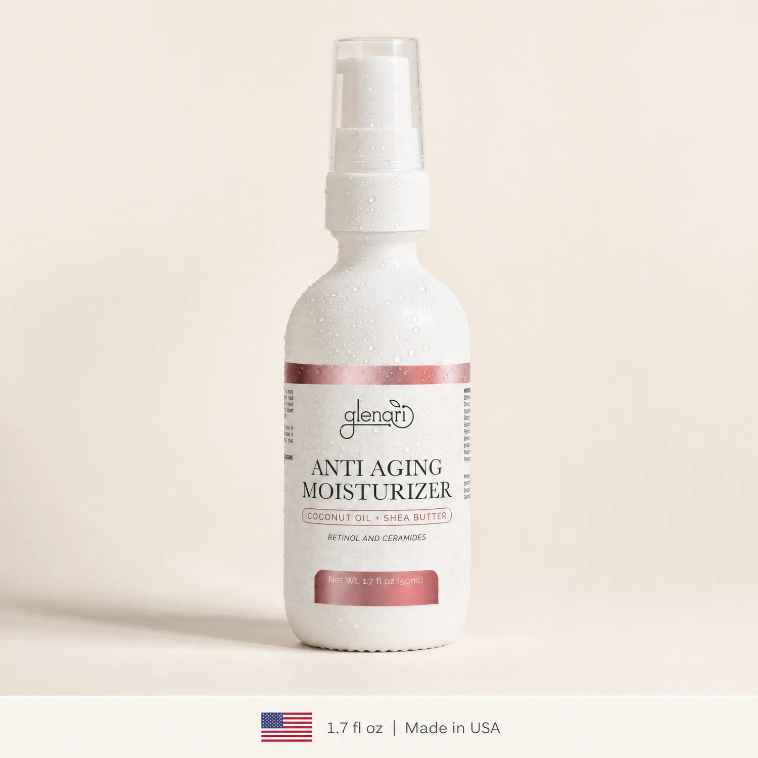 A white spray bottle of Glenari Anti-Aging Moisturizer with a clear cap, set against a warm beige background. The bottle features a white label with dusty rose accents and condensation droplets.