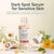 A bottle of Glenari Dark Spot Serum for sensitive skin, shown with its dropper on a light surface surrounded by chamomile flowers, sliced mushrooms, and green leaves. The image includes text overlays at the top describing the product benefits.
