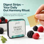 A hand holds a square gold-colored digestive strip next to a tin of Glenari Digest Strips, surrounded by fresh berries on a white surface with a light teal background and promotional text.