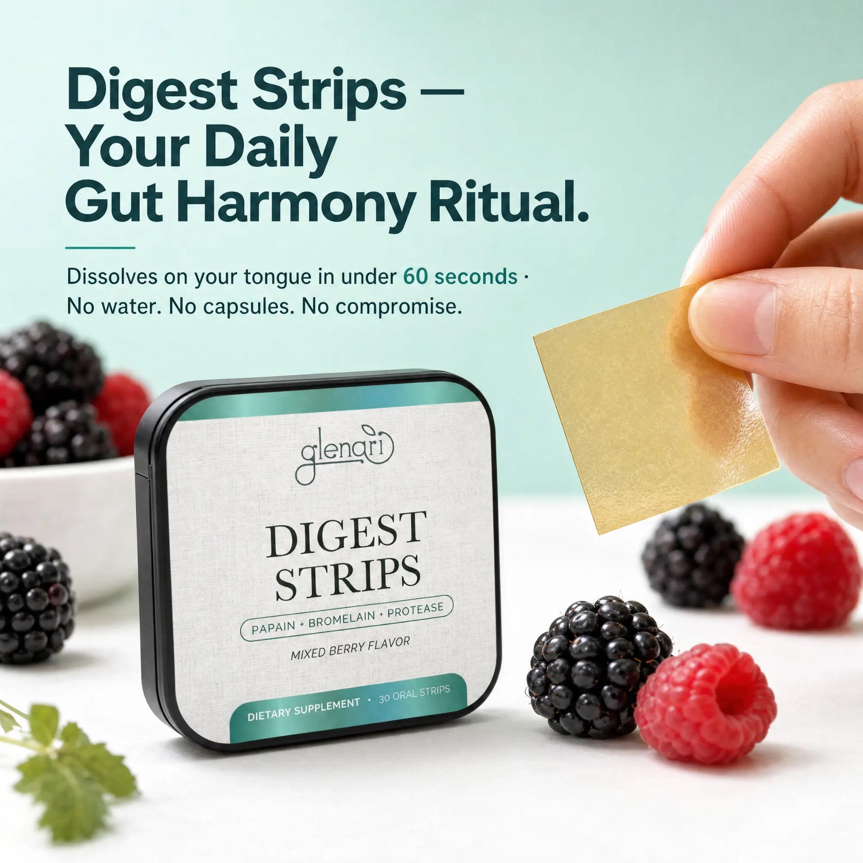 A hand holds a square gold-colored digestive strip next to a tin of Glenari Digest Strips, surrounded by fresh berries on a white surface with a light teal background and promotional text.