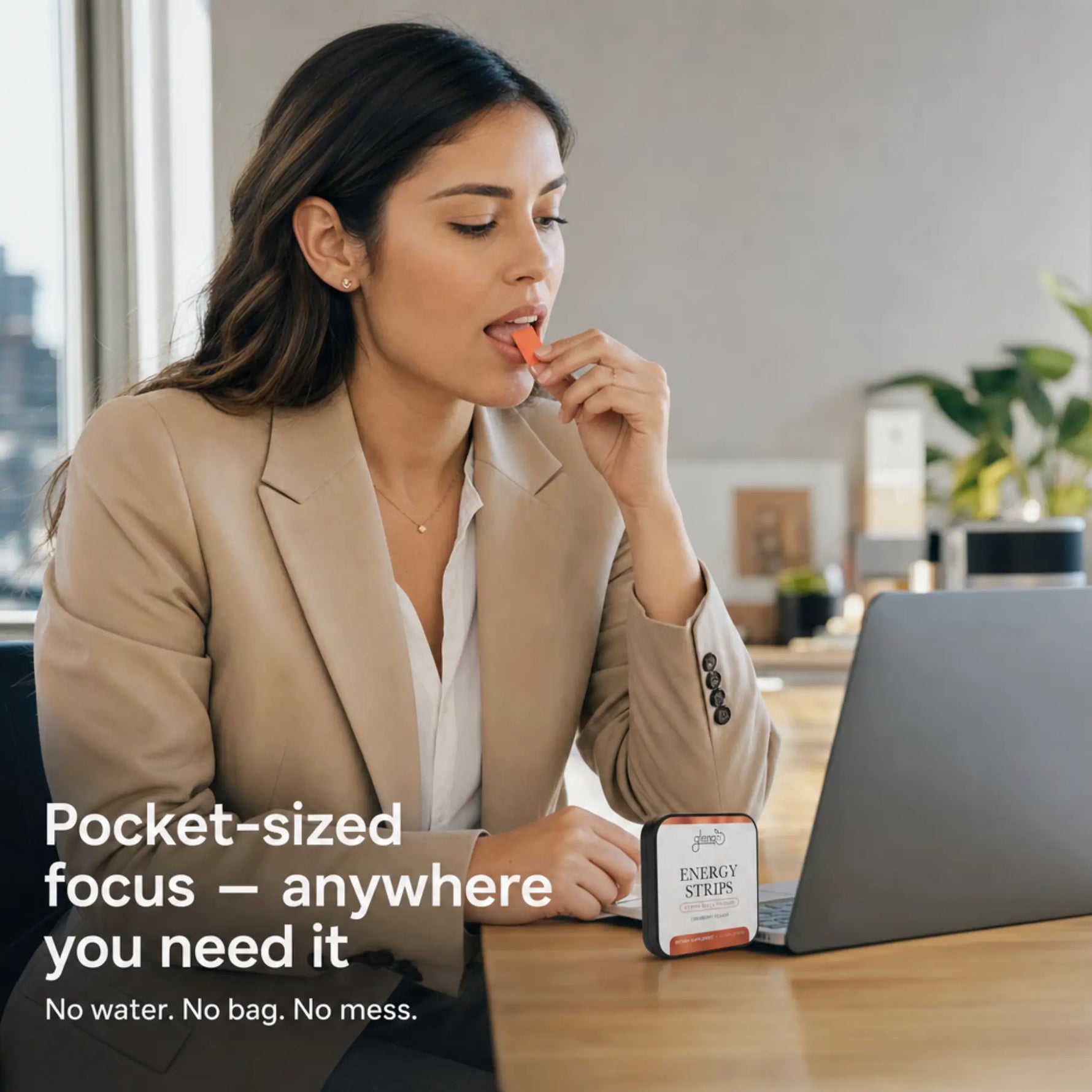 A woman in a beige blazer sits at a desk using a laptop and eating an orange energy strip from a small branded packet. Text on the image reads, 'Pocket-sized focus — anywhere you need it.