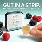 A hand holds a single gut strip product against a mint background with mixed berries around a tin labeled Glenari Gut Strips. Large text at the top reads 'GUT IN A STRIP.