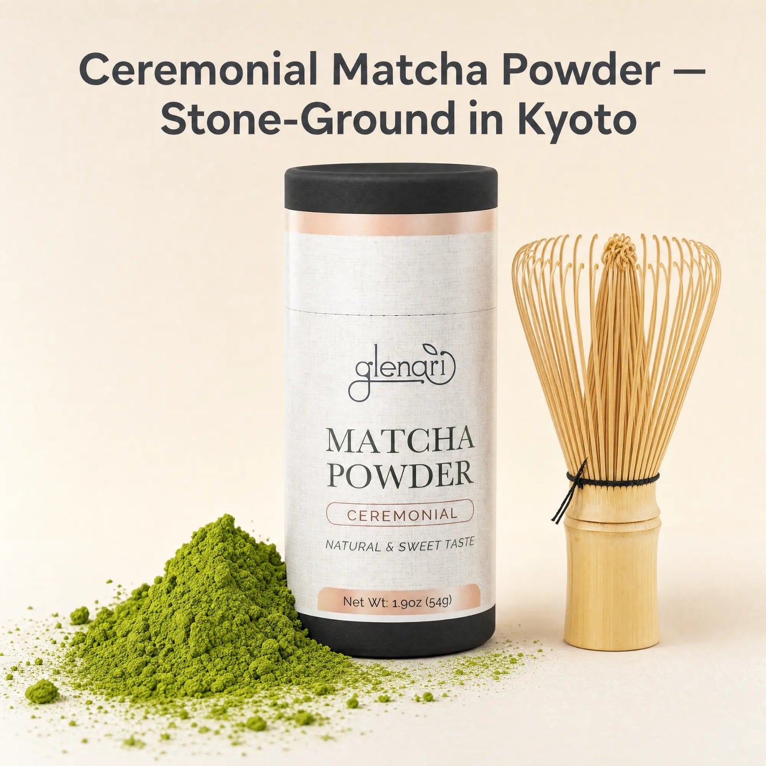 Glenari ceremonial matcha powder in a white cylindrical container with a black lid, shown beside a bamboo whisk and a small pile of bright green matcha powder on a warm beige background. Text at the top reads 'Ceremonial Matcha Powder — Stone-Ground in Kyoto'.
