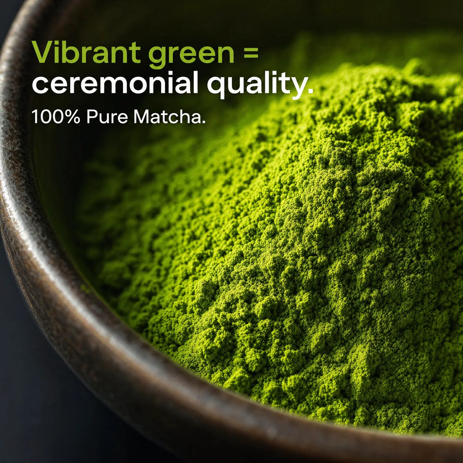 Close-up of bright green matcha powder piled in a dark bowl, with text reading 'Vibrant green = ceremonial quality. 100% Pure Matcha.