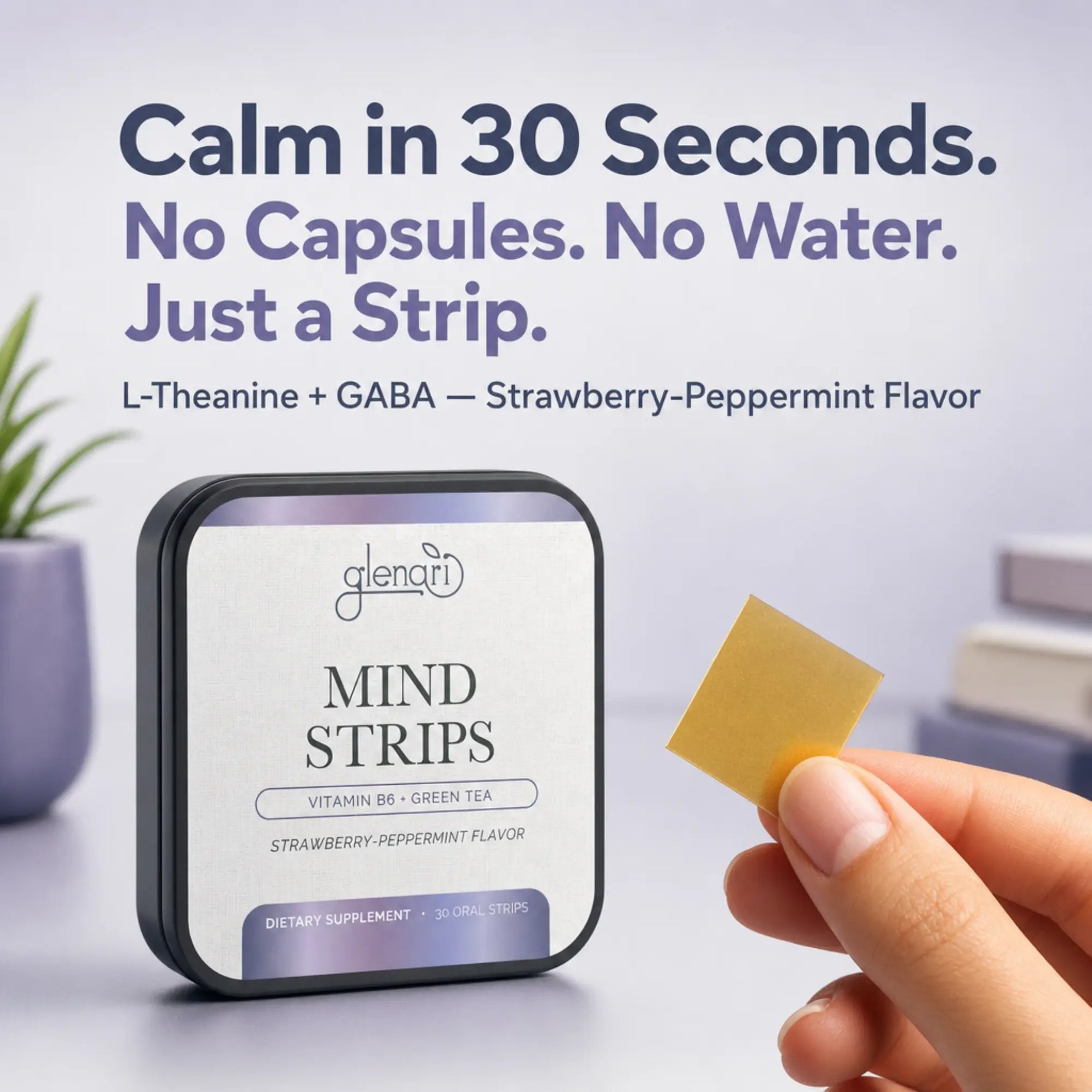 A hand holds a small yellow square strip next to a tin of Glenari Mind Strips in strawberry-peppermint flavor. The background is a clean, light studio setting with promotional text at the top.