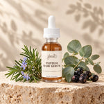 Glenari Peptide Hair Serum premium glass dropper bottle with natural rosemary and eucalyptus elements.