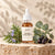 Glenari Peptide Hair Serum premium glass dropper bottle with natural rosemary and eucalyptus elements.