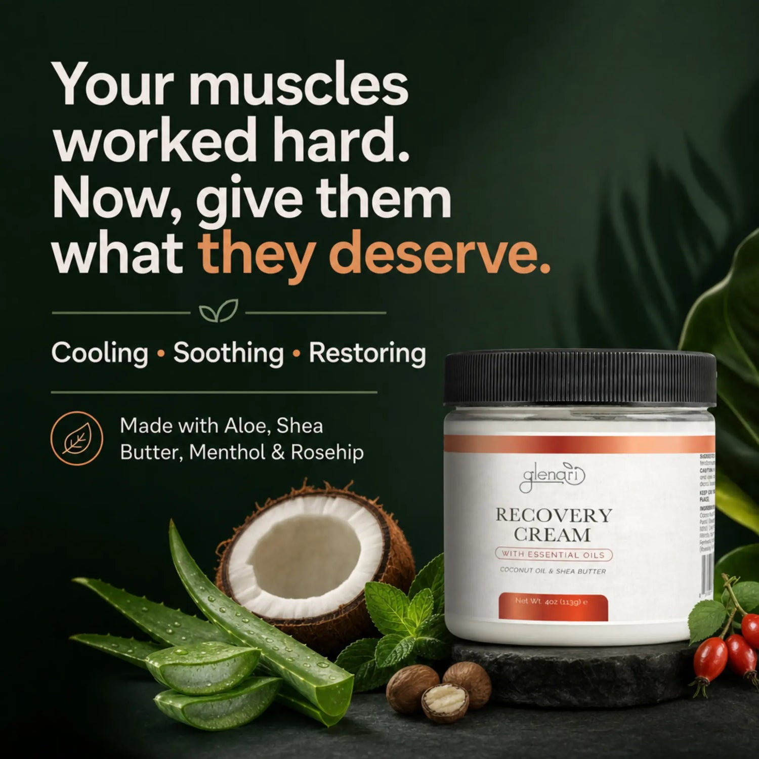 A jar of Glenari Recovery Cream coconut oil & shea butter shown on a dark green background with promotional text, aloe vera leaves, a coconut, nuts, and red berries around it.