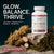 A bottle of Glenari Sea Moss dietary supplement displayed on a stone surface with dried sea moss, roots, and bark props against a dark teal background. Large text on the left reads 'GLOW. BALANCE. THRIVE.'
